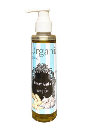 Herbal ginger garlic hair oil in clear bottle with white pump cap