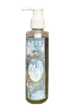Herbal hairfruit oil in clear bottle with white pump cap
