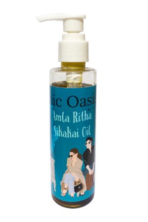 Herbal amla ritha sikakai hair oil in clear bottle with white pump cap